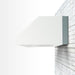 Stono Outdoor Living The TrueFlame 4" Spacer Bracket for 36" Outdoor Vent Hood (TF-VH36-2-SP4) is shown on a white brick wall, highlighting its modern, minimalist style—ideal for contemporary kitchens seeking a sleek and clean look.