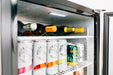 Stono Outdoor Living Open the stainless steel door of the TrueFlame 24" 5.3 Cu. Ft. Deluxe Outdoor Rated Refrigerator to reveal illuminated shelves stocked with White Claw, IPA beer, and white wine—perfect for built-in or outdoor use.
