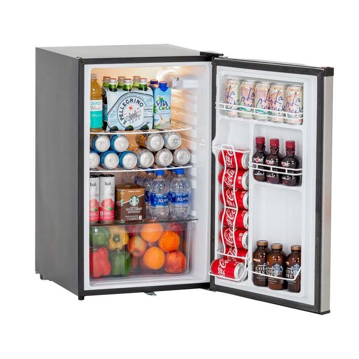 Stono Outdoor Living The TrueFlame 22" 4.1c Outdoor Approved Fridge (AMD-RFR-22S) with a reversible lock door stands open, stocked with drinks, bottles, sparkling water on shelves and bell peppers, oranges, and apples in the drawers.