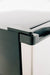 Stono Outdoor Living Close-up of the top corner of the TrueFlame 22" 4.1c Outdoor Approved Fridge (AMD-RFR-22S) with stainless steel, showing its hinge and part of the handle against a white background. Reversible door with lock feature is highlighted.