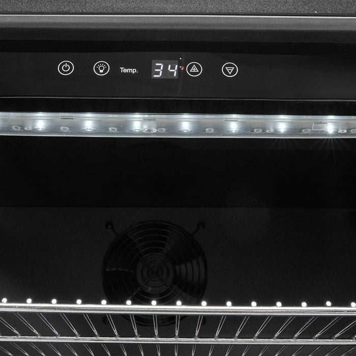 Stono Outdoor Living Close-up of the Coyote 24" Outdoor Refrigerator (C124R-S) digital display set to 34°F, showing control buttons, LED-lit interior, adjustable shelves, and visible cooling fan inside.