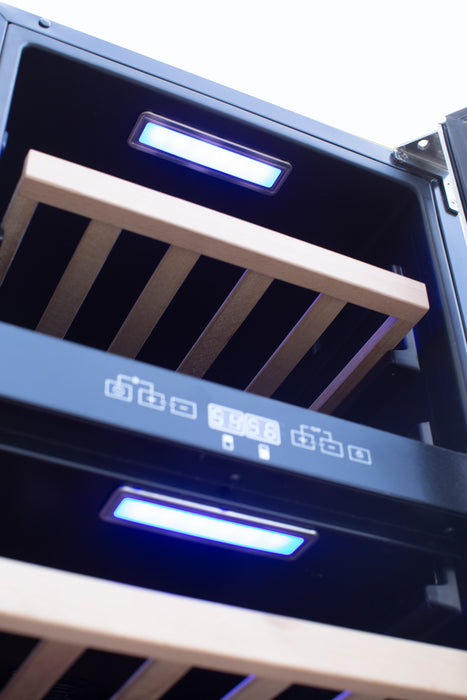 Stono Outdoor Living Close-up of the TrueFlame 15" 3.2 Cu. Ft. Outdoor Rated Single Zone Wine Cooler (AMD-RFR-15W) with wooden shelves and blue LED lighting—perfect to pair with stainless steel appliances in modern outdoor kitchens.