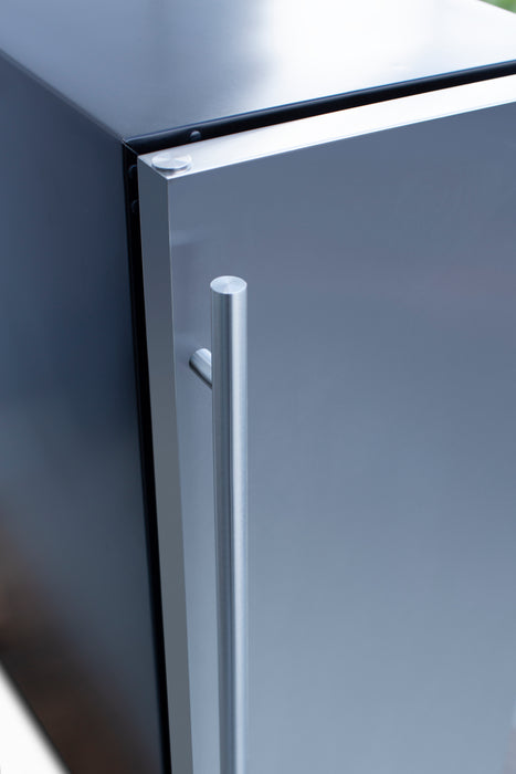 Stono Outdoor Living A close-up of the TrueFlame 15" 3.2 Cu. Ft. Outdoor Rated Refrigerator (AMD-RFR-15S) door highlights its modern stainless steel design, sleek vertical handle, and side panel—an ideal fit for any outdoor kitchen.
