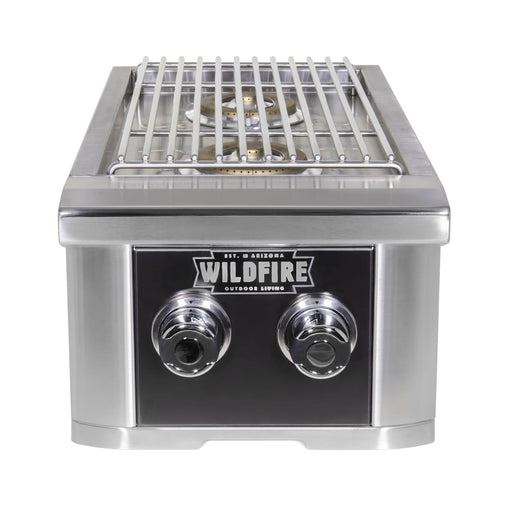 Stono Outdoor Living The Wildfire Ranch Pro Double Side Burner 304 Black SS Natural Gas features two control knobs and a metal grate, making it perfect for your outdoor kitchen. Branded with the Wildfire Outdoor Living logo on the front panel.