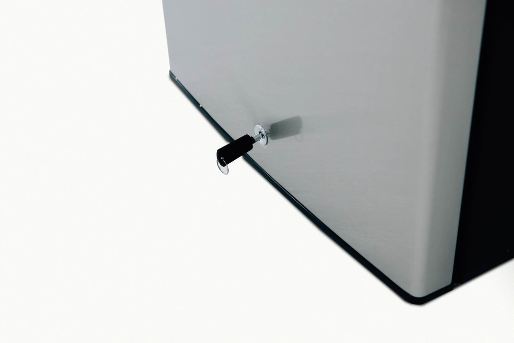 Stono Outdoor Living A close-up of the TrueFlame 22" 4.1c Outdoor Approved Fridge (AMD-RFR-22S) shows its gray stainless steel door with a black key in the lock, highlighting its secure, compact design from TrueFlame.