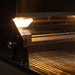 Stono Outdoor Living Close-up of the TrueFlame 40" 5-Burner Built-In Propane Gas Grill (TF40L) interior, with grilling racks and textured surfaces visible under a built-in light, highlighting the clean and unused space.