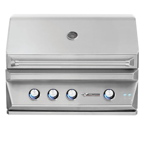 Stono Outdoor Living The Twin Eagles 36-Inch 3-Burner Built-In Natural Gas Grill (TEBQ36R-CN) features stainless steel burners, four blue-lit control knobs, a built-in lid thermometer, and the Twin Eagles logo on the front panel.