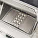 Stono Outdoor Living A close-up of the Twin Eagles Wi-Fi Controlled 36-Inch Built-In Stainless Steel Pellet Grill and Smoker (TEPG36G) shows its metal heat plates and ceramic briquettes neatly arranged above the burners.