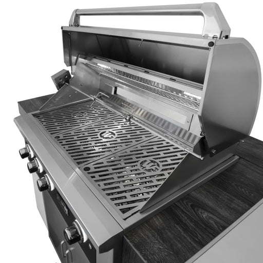 Stono Outdoor Living The Wildfire Outdoor Living 42" Rotisserie Kit (WFROTISKIT42) is displayed on a dark countertop with the lid open, showing clean grates and multiple front control knobs—perfect for slow-roasted outdoor meals.