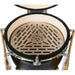 Stono Outdoor Living Top view of a Coyote Asado Smoker w/ Stand & Side Shelves (C1CHCS-FS), featuring a kamado-style charcoal grill with the COYOTE-branded grate, textured black ceramic exterior, and metal hinges—perfect for outdoor cooking.