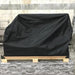 Stono Outdoor Living A large object covered with the Tagwood BBQ Grill Cover for BBQ25SS Grill (BBQ87SS) by Tagwood BBQ sits on a wooden pallet on a stone-patterned surface, with a concrete block wall in the background.
