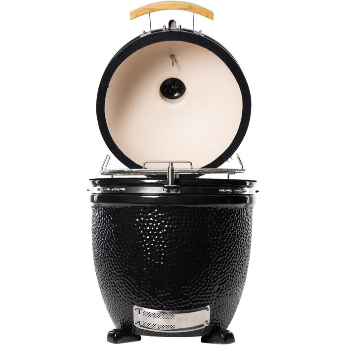 Stono Outdoor Living The Coyote Asado Smoker, Built-In - C1CHCS by Coyote is a black ceramic kamado-style charcoal grill with a textured exterior, wooden handle, stainless steel hardware, and precise temperature control for outdoor cooking.