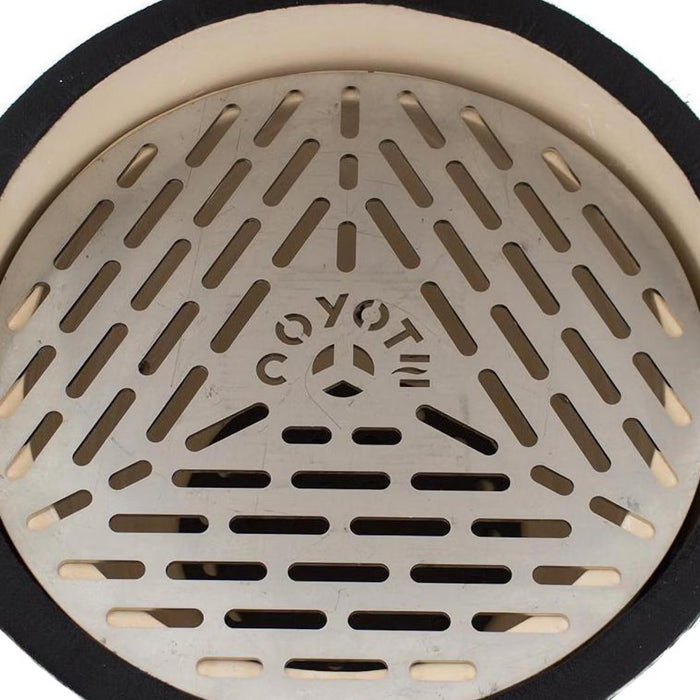 Stono Outdoor Living A close-up of the Coyote Asado Smoker (C1CHCS) grill grate shows diagonal slots and "COYOTE" cutout in the center, designed for precise temperature control and bordered by a black edge.