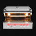 Stono Outdoor Living The TrueFlame 32" 4-Burner Built-In Natural Gas Grill (TF32) by TrueFlame is shown with four red-lit control knobs, open lid, interior lights illuminating clean stainless steel grates, set against a bold black background.