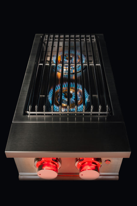 Stono Outdoor Living The TrueFlame Gas Double Side Burner - TFSB2L by TrueFlame is a stainless steel grill with two blue-lit burners, metal grate, and two red control knobs, all set against a sleek black background—perfect for any outdoor kitchen.