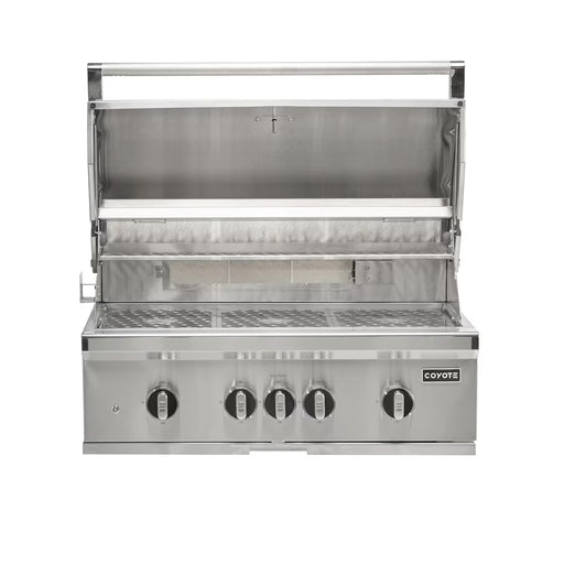 Stono Outdoor Living The Coyote 36" SL-Series Grill, shown with a raised lid, features four control knobs, LED lights, ceramic elements, and a metal grate—ideal for outdoor kitchens. The Coyote brand appears on the right side of the front panel. Natural gas model.
