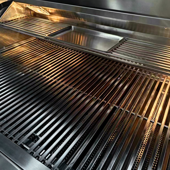 Stono Outdoor Living Close-up of the TrueFlame 25" 3-Burner Built-In Natural Gas Grill - TF25 by TrueFlame, showcasing its sleek stainless steel grill grate and built-in rectangular tray under bright lighting for a polished, professional look.