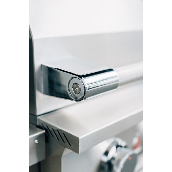 Stono Outdoor Living Close-up of the TrueFlame E Series 25" 3-Burner Built-In Propane Gas Grill (TFE25L) shows its shiny #304 stainless steel handle and temperature gauge, highlighting the modern design and quality craftsmanship of this commercial-grade grill.