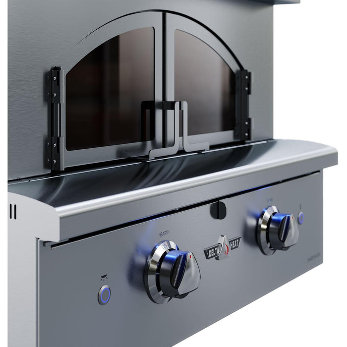 Stono Outdoor Living Close-up of the Delta Heat Freestanding Pizza Oven (Natural Gas, DHPO30F-N) featuring a stainless steel build, two glass-panel doors, blue-lit control knobs, and precise temperature control for artisan pizza in a sleek modern design.
