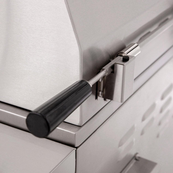Stono Outdoor Living Close-up of the American Made Grills Estate 30-Inch Grill (EST30-NG), featuring a black side handle and detailed stainless steel construction on the lid and body.