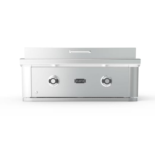 Stono Outdoor Living The Wildfire Ranch Pro 30" Griddle 304 SS Natural Gas by Wildfire Outdoor Living features a sleek stainless steel design, two front control knobs, and a closed lid—ideal for versatile backyard cooking in your outdoor kitchen.