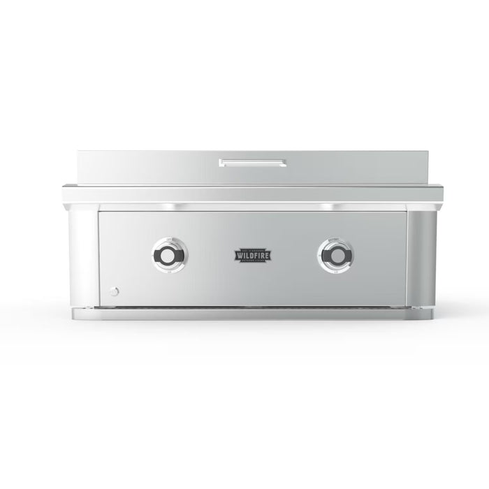 Stono Outdoor Living The Wildfire Ranch Pro 30" Griddle 304 SS Natural Gas by Wildfire Outdoor Living features a sleek stainless steel design, two front control knobs, and a closed lid—ideal for versatile backyard cooking in your outdoor kitchen.