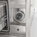 Stono Outdoor Living Close-up of the Coyote C3-WD Warming Drawer’s stainless steel control panel, featuring a round dial with OFF, HI, and MI settings. An open compartment is visible—ideal for outdoor kitchens.
