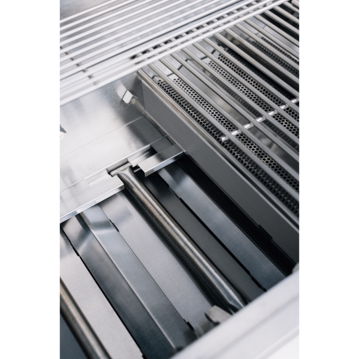 Stono Outdoor Living Close-up of the TrueFlame E Series 32" Built-In Natural Gas Grill (TFE32) shows its #304 stainless steel grates, burners, and heat plates neatly arranged inside the commercial-grade body.