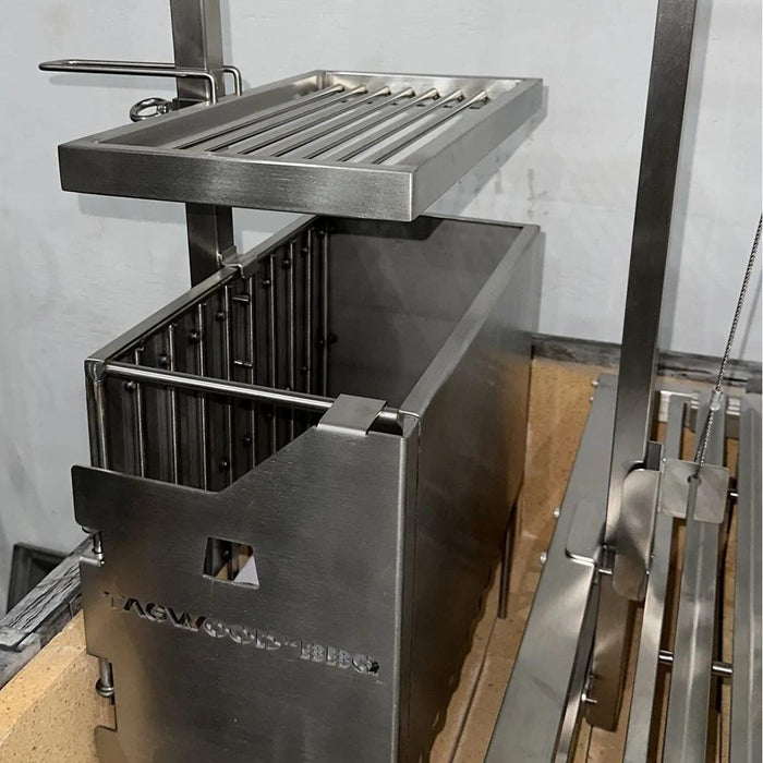 Stono Outdoor Living A close-up of the Tagwood BBQ Height Adjustable Secondary Grate for BBQ09SS Grill (BBQ96SS) by Tagwood BBQ shows its sturdy metal rods, handles, and adjustable surface above a rectangular firebox.