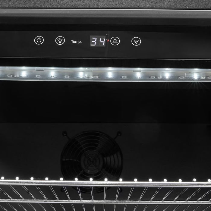 Stono Outdoor Living Close-up of the Coyote 21" Outdoor Refrigerator (C121R-S-L) digital control panel showing 34°F, touch buttons, LED lights, a stainless steel shelf, and cooling fan—ideal for any modern outdoor kitchen.