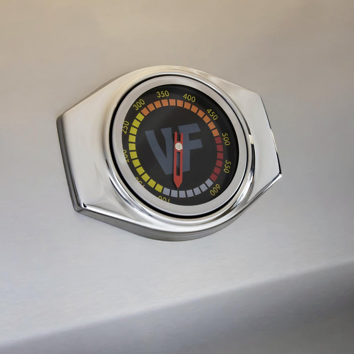 Stono Outdoor Living A close-up of a round grill thermometer on the Wildfire Outdoor Living Wildfire Ranch Pro 36" Gas Grill 304 Black SS Propane (WFPRO36G-BSS-LP), displaying 100–600°F, with the needle near 250°F.