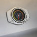Stono Outdoor Living A close-up of a round, chrome-edged temperature gauge on the Wildfire Ranch Pro 42" Gas Grill by Wildfire Outdoor Living shows colored markings from 150 to 550 degrees. The needle points to about 275°F, with VF visible in the center.