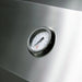 Stono Outdoor Living A close-up of a round analog temperature gauge set in the stainless steel surface of the TrueFlame 32" 4-Burner Built-In Natural Gas Grill (TF32), showing temps in Fahrenheit and Celsius for precise cooking.