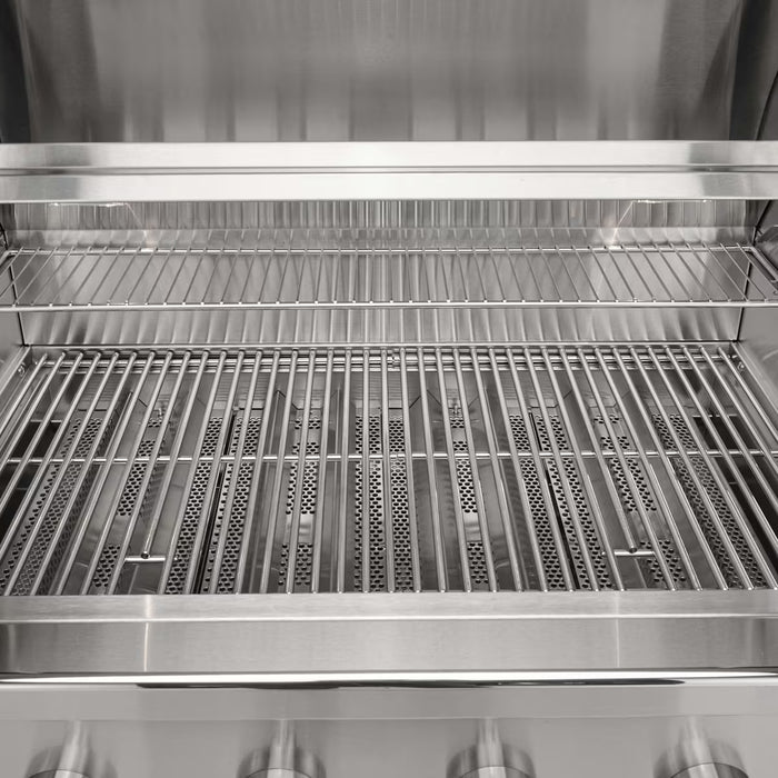 Stono Outdoor Living A close-up of the Coyote 42" CL-Series Grill (C3CL42NG) shows its clean stainless steel design, wide cooking grates, warming rack, and easy-access control knobs—ideal for any modern outdoor kitchen.