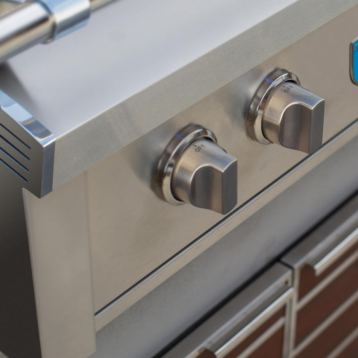 Stono Outdoor Living Close-up of two stainless steel control knobs on the American Made Grills Estate 30-Inch Natural Gas Grill (EST30-NG), with part of its shiny surface and built-in drawers below them.