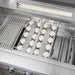 Stono Outdoor Living Close-up of the Delta Heat 38-Inch 3-Burner Built-In Natural Gas Grill (DHBQ38RS-DN) shows grill grates, ceramic briquettes, burner tubes, and control knobs. The premium stainless steel build includes a sear zone and infrared rotisserie burner.