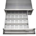 Stono Outdoor Living The Coyote Warming Drawer - C3-WD by Coyote is shown partially open from above. This stainless steel warming drawer features a vented, perforated tray, solid handle, and a control knob on the upper right—ideal for outdoor kitchens.