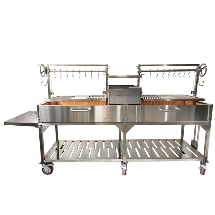 Stono Outdoor Living The Tagwood BBQ XL Double Argentine Santa Maria Wood Fire & Charcoal Grill (BBQ24SS) by Tagwood BBQ features two grill racks, tool hooks, a central firebox, side and lower storage shelves, and wheels for mobility.