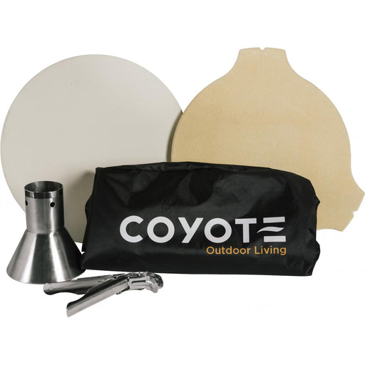 Stono Outdoor Living The Coyote Asado Smoker Accessory Bundle (ASADO-ACC) by Coyote features a carrying bag, metal pizza peel, metal cone, and two pizza stones—one round and one with a handle edge—for versatile outdoor grilling.