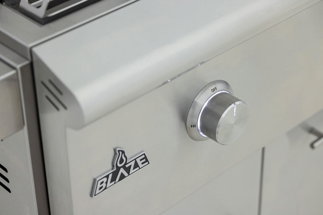 Stono Outdoor Living Close-up of the Blaze LTE+ 30-Inch Built-in Propane Gas Griddle (BLZ-GRIDDLE-LTE3-LP) by Blaze, featuring a stainless steel design, lift-assist hood, round control knob from OFF to HI, and BLAZE logo—ideal for any outdoor setup.