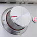 Stono Outdoor Living A close-up of the Blaze Premium LTE+ 32" 4-Burner Propane Grill’s metallic control knob and red indicator shows settings between HI and LOW on its stainless steel surface, with searing rods and a red-ringed button in the background.