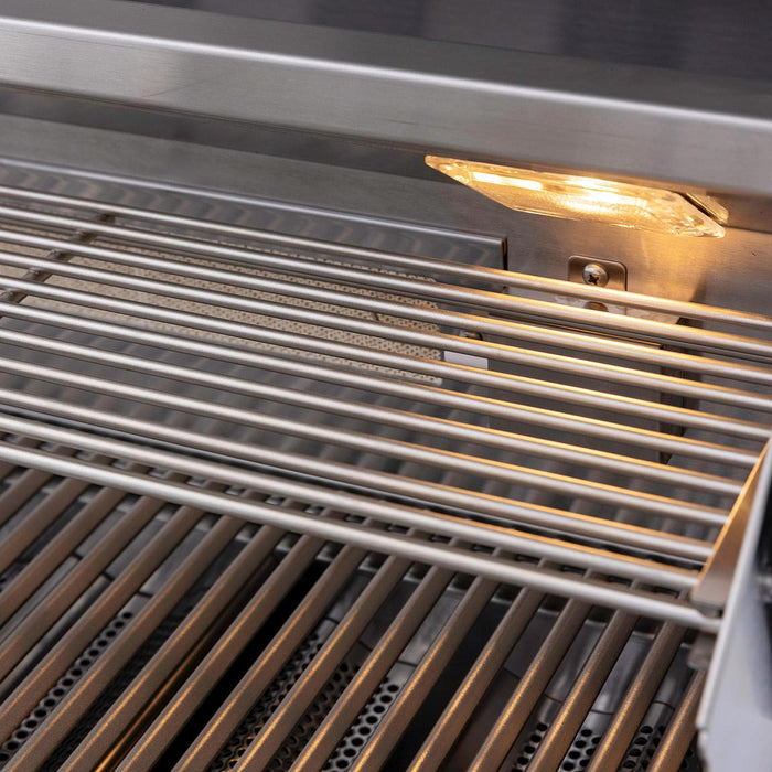 Stono Outdoor Living Close-up of the Blaze Premium LTE+ 32" 4-Burner Propane Grill’s clean stainless steel rods and built-in grill lights. Enjoy lasting quality from Blaze, backed by a lifetime warranty. Model: BLZ-4LTE3-LP.