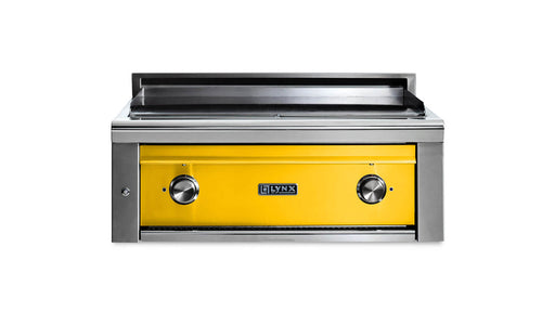 Stono Outdoor Living The Lynx 30” Asado Built-In Grill in California Poppy (L30AG-CANG) features a vibrant yellow front, two black knobs, and the Lynx logo—ideal for luxury outdoor kitchens. Set against a plain white background.