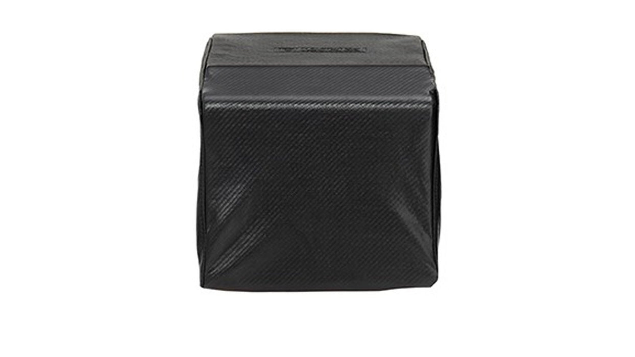 Stono Outdoor Living A black, cube-shaped object with a textured surface, identified as the Lynx Single Side Burner Carbon Fiber Vinyl Cover (built-in) - CCLSB1 by Lynx, is shown against a white background.
