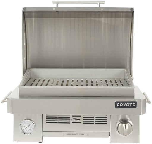Stono Outdoor Living The Coyote 25" Portable Grill (C1PORTLP) features a ceramic high-heat burner, marine-grade stainless steel construction, a front-left temperature gauge, and right-side control knob for precise grilling wherever you go.