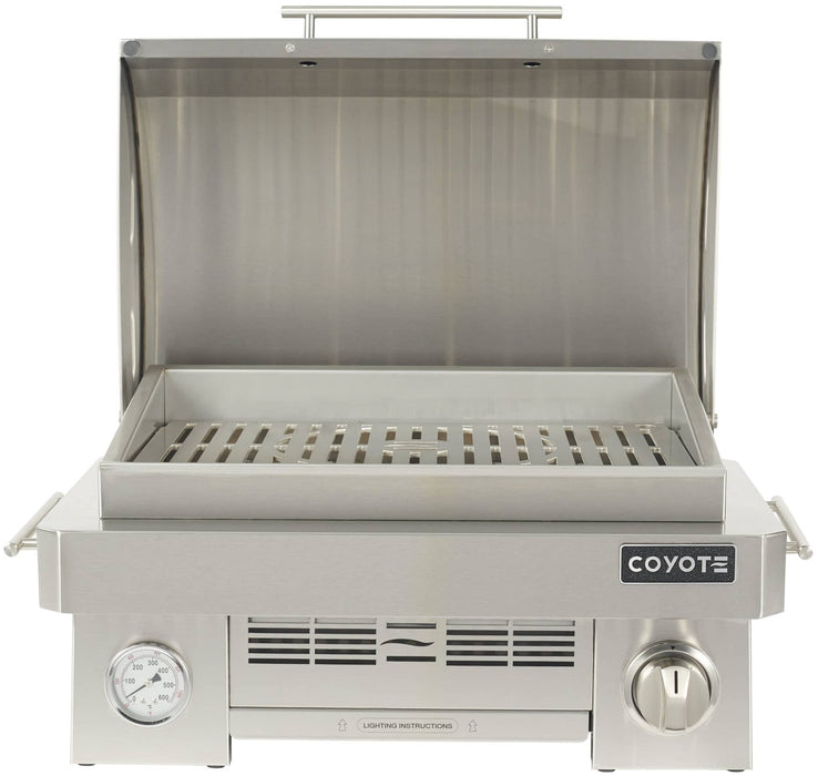 Stono Outdoor Living The Coyote 25" Portable Grill (C1PORTLP) features a ceramic high-heat burner, marine-grade stainless steel construction, a front-left temperature gauge, and right-side control knob for precise grilling wherever you go.