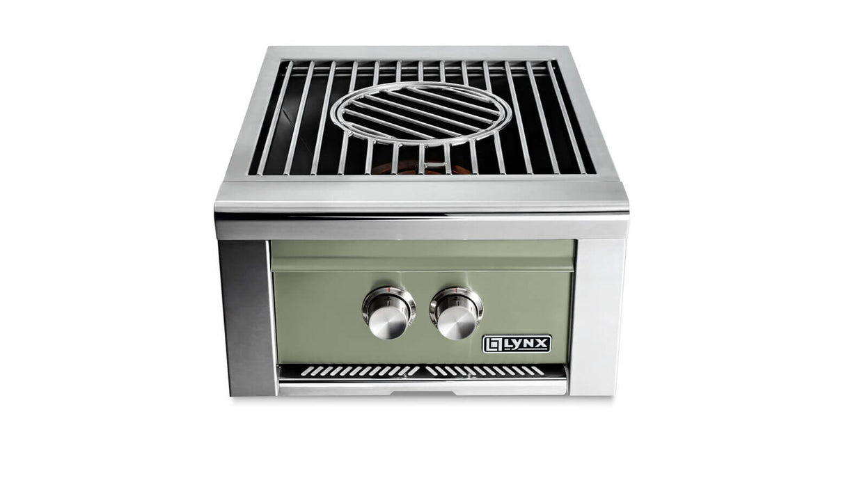 Stono Outdoor Living Front view of the Lynx Power Burner in Desert Sage (LPB-DSNG) by Lynx, featuring two control knobs, a high-BTU burner, and a rectangular grate with a central circular section—ideal for versatile outdoor cooking.