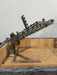 Stono Outdoor Living The Tagwood BBQ Basement Grill - BBQ94SS by Tagwood BBQ features a large SS 304 clamp grill grate with adjustable angled height, mounted over a brick and stone barbecue pit and supported by a sturdy notched metal frame.
