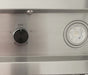 Stono Outdoor Living A close-up of a Blaze 48-Inch Stainless Steel Vent Hood (BLZ-48-VHOOD) shows a metallic panel with a black knob labeled 1 to 4 and OFF, next to an LED light and commercial-grade baffles.