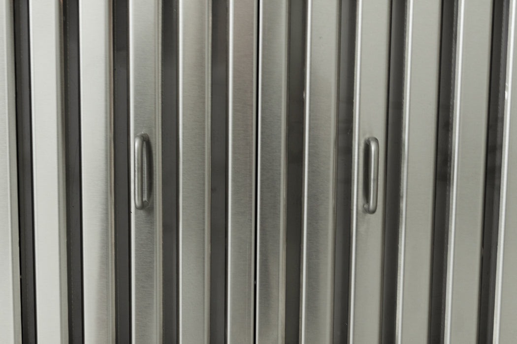 Stono Outdoor Living Close-up of evenly spaced vertical metallic panels with two recessed handles on the Blaze 48-Inch Stainless Steel Vent Hood (2000 CFM, BLZ-48-VHOOD) by Blaze. The surface features a brushed steel finish.